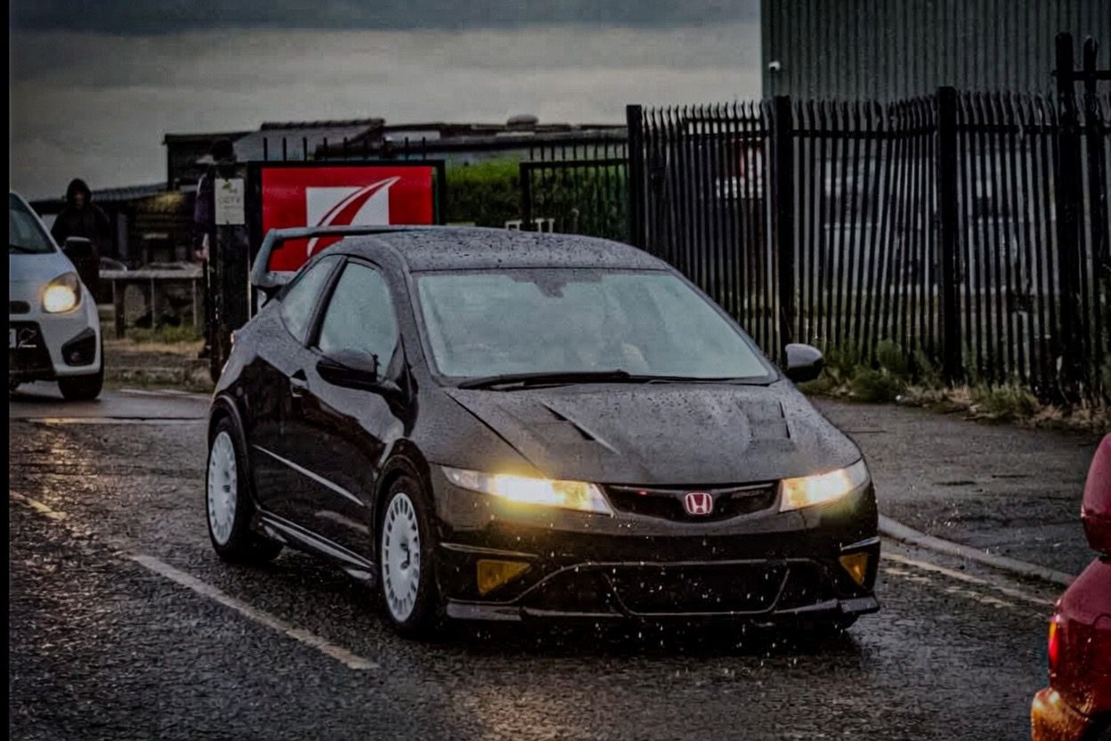 Black Honda Civic Type R FN2 on white 17 inch Bola wheels at M60 Modified Friday night car meet, Barton Aerodrome